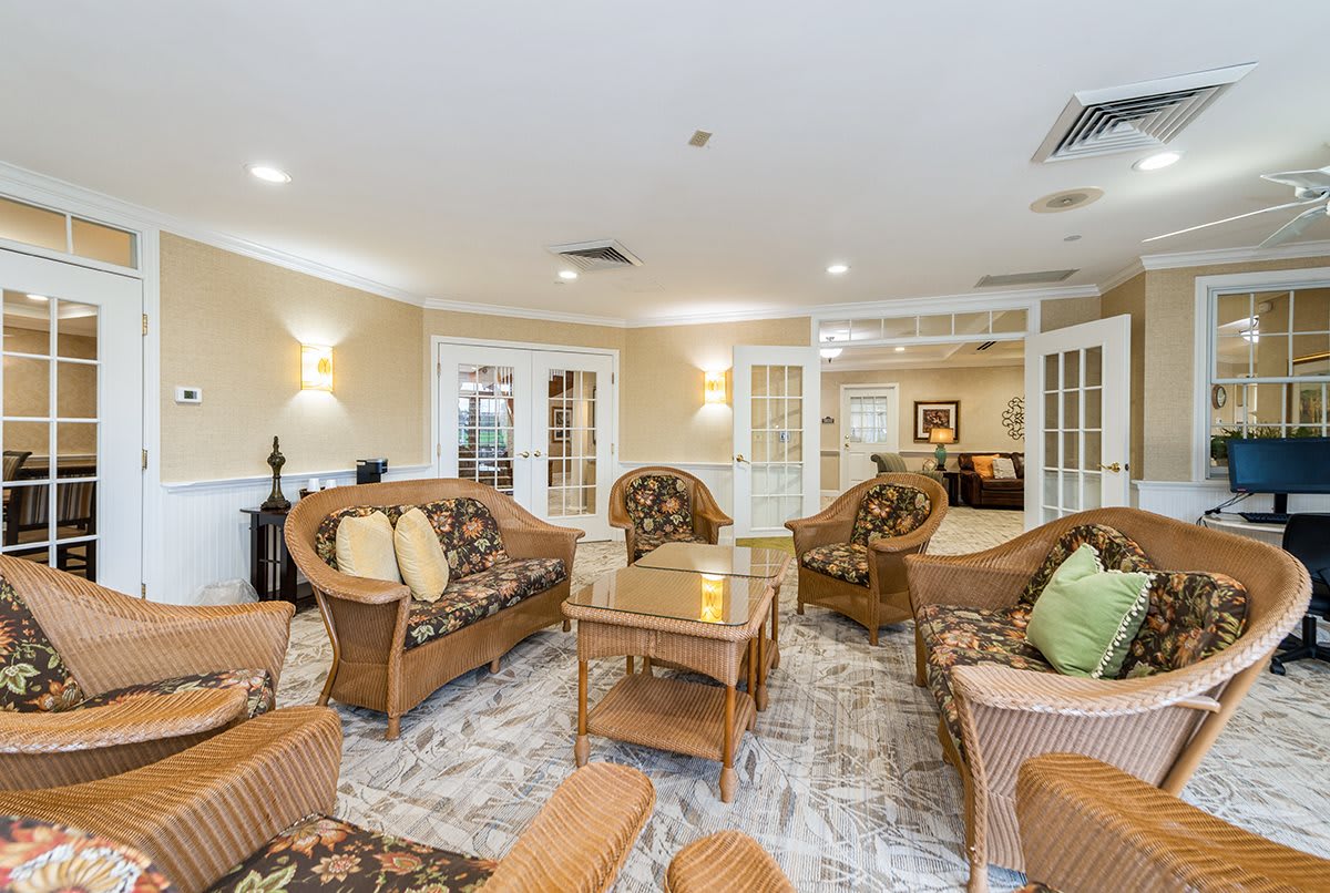 A cozy living room with wicker furniture and soft lighting.
