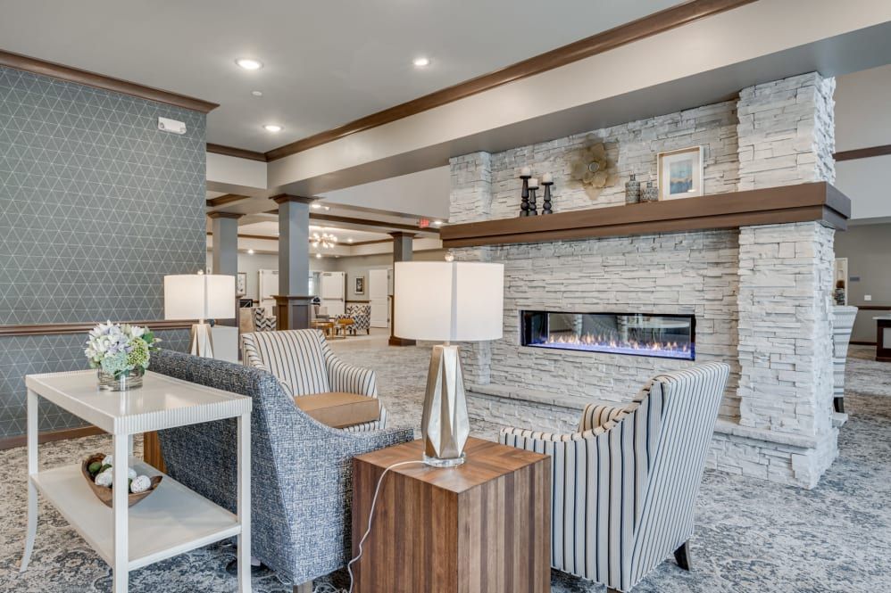 A modern living room with a cozy seating area and fireplace.