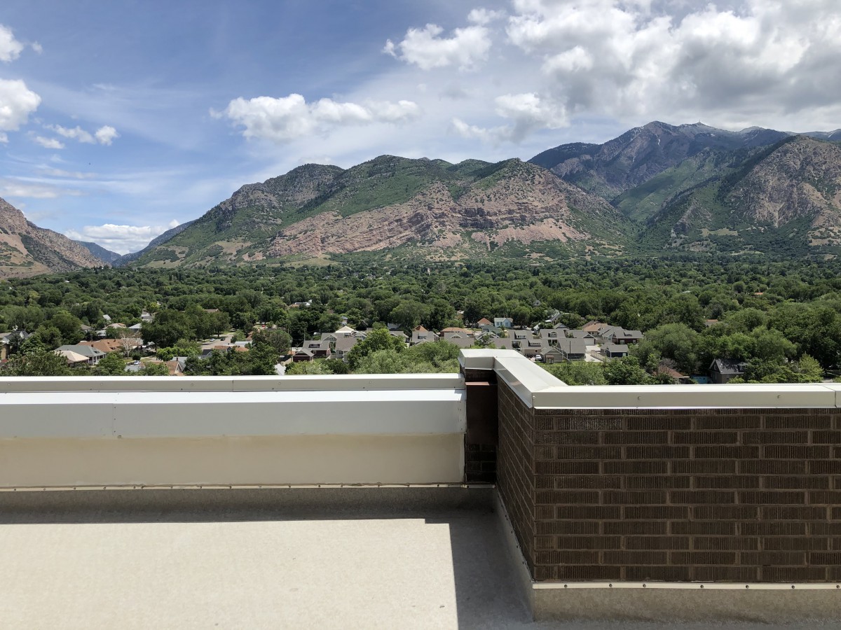 A beautiful view of mountains under a partly cloudy sky.