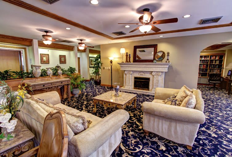 A cozy living room with elegant furniture and a fireplace.