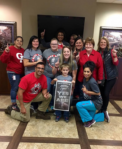 A joyful group showcasing their team spirit together.