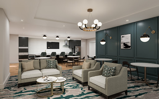 A stylish and modern living room featuring comfortable seating, elegant lighting, and vibrant decorative elements.