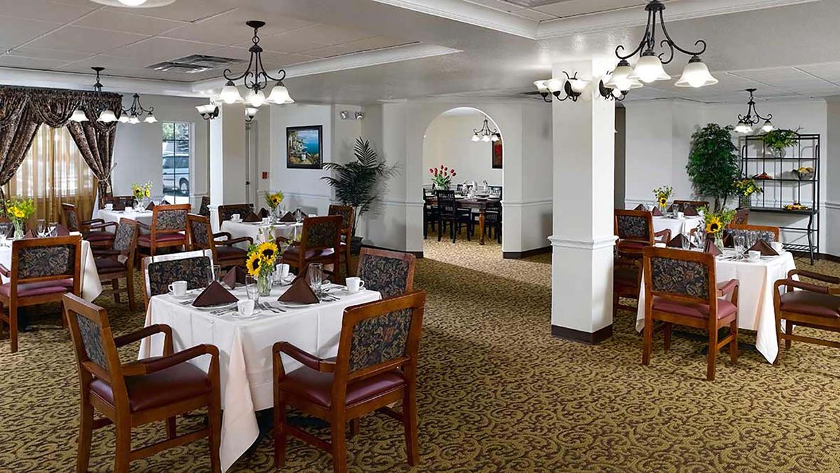Elegant dining room with neatly arranged tables and classic decor.