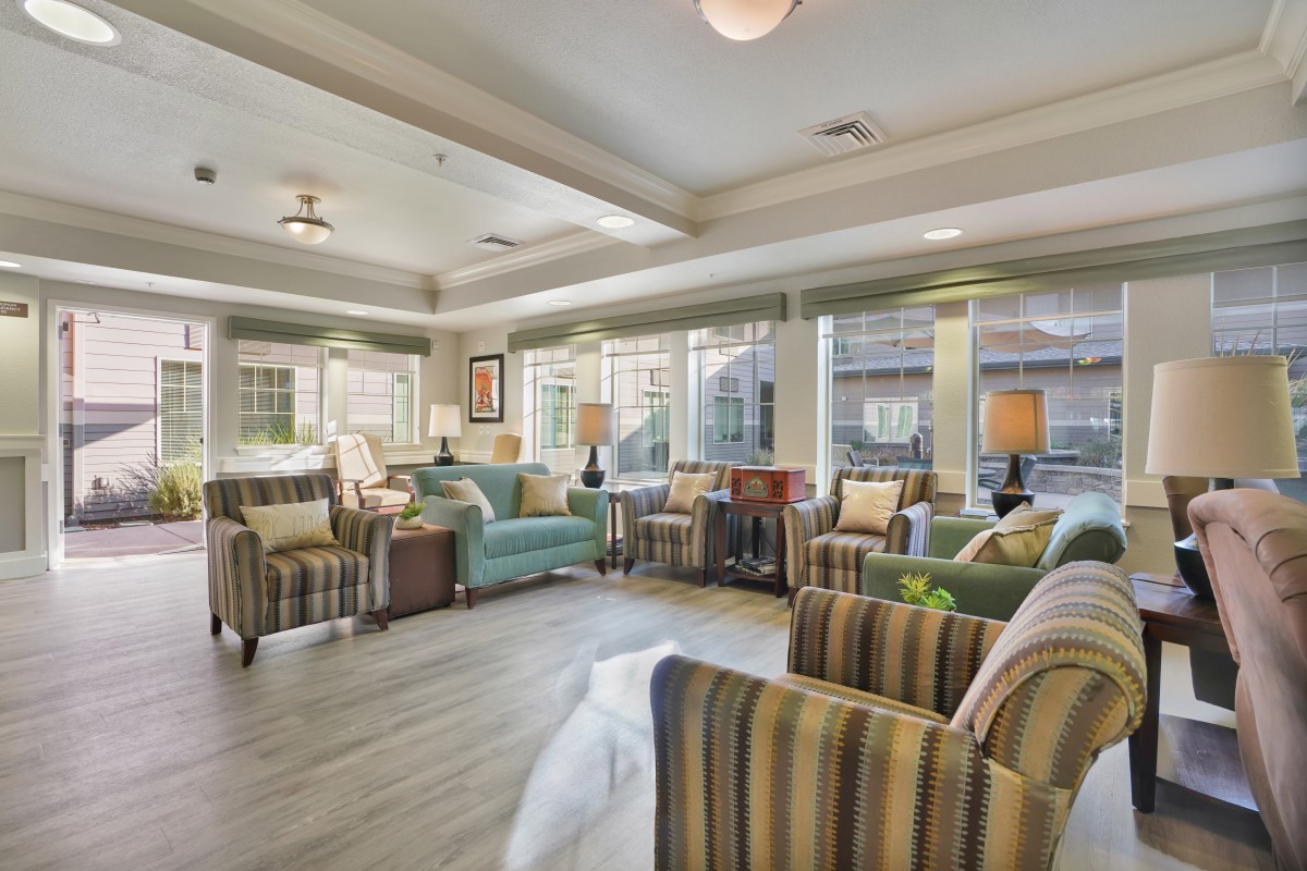 A modern living room with comfortable seating and ample natural light.