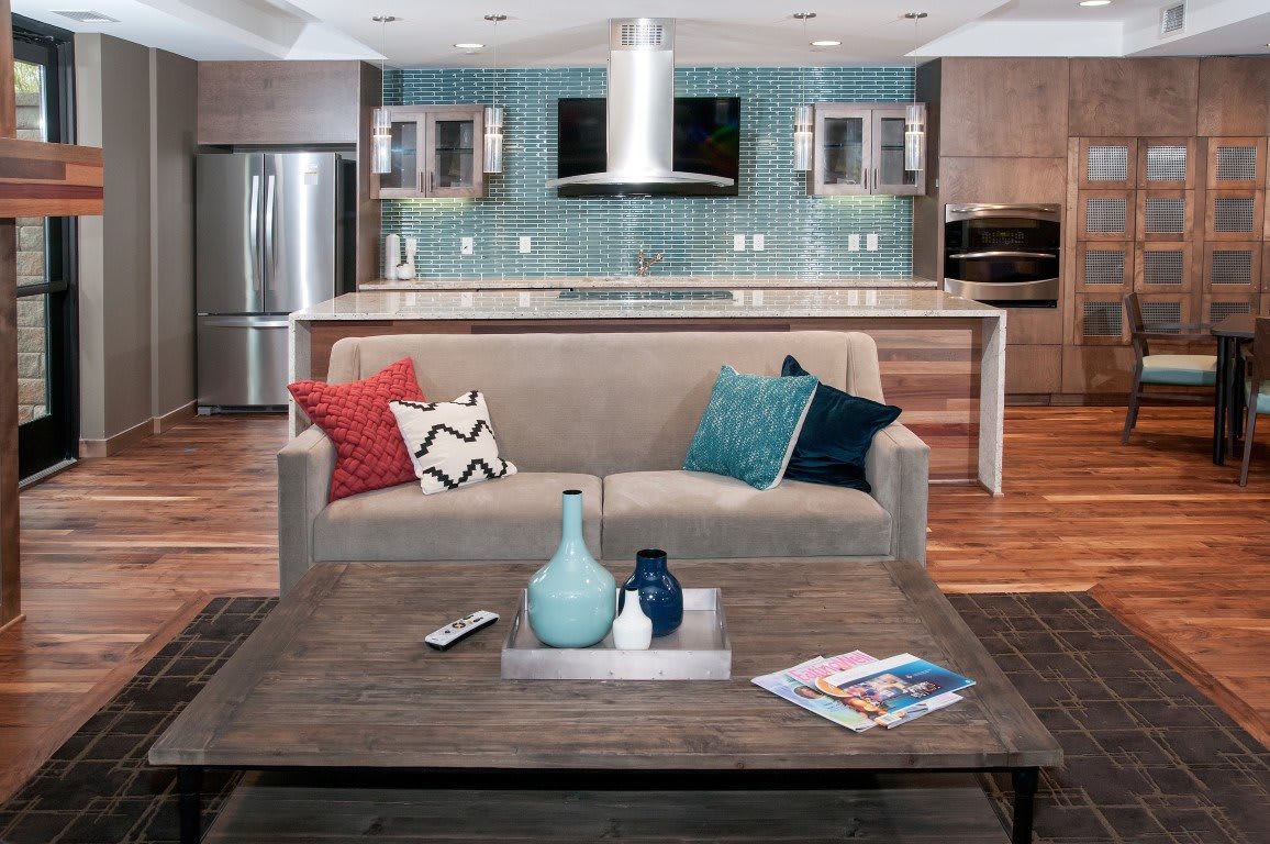 A modern open-plan living room and kitchen with stylish decor.