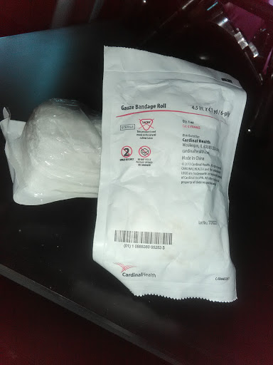 A sterile medical package alongside a white powder substance.
