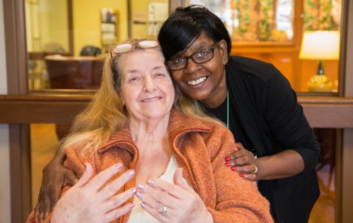 Two women sharing a happy moment together.