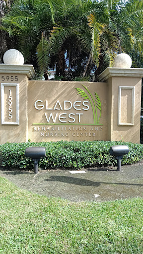 Sign welcoming visitors to Glades West community.