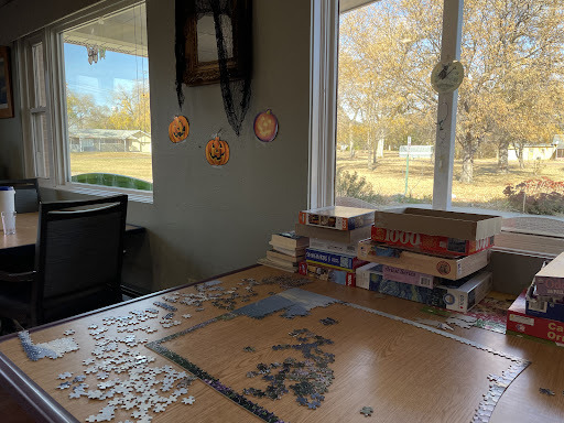 A cozy puzzle setup by the window, bringing warmth and focus to a winter afternoon.