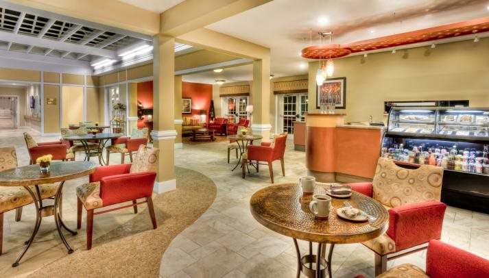 A cozy restaurant interior with warm lighting and comfortable seating.