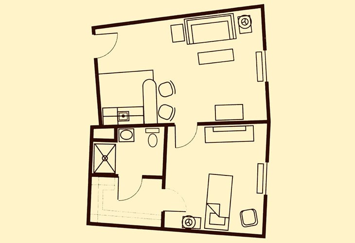 A simple floor plan depicting the layout of a small apartment with living areas, kitchen, and bathroom.