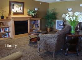 A cozy living room with an elegant fireplace and comfortable seating.