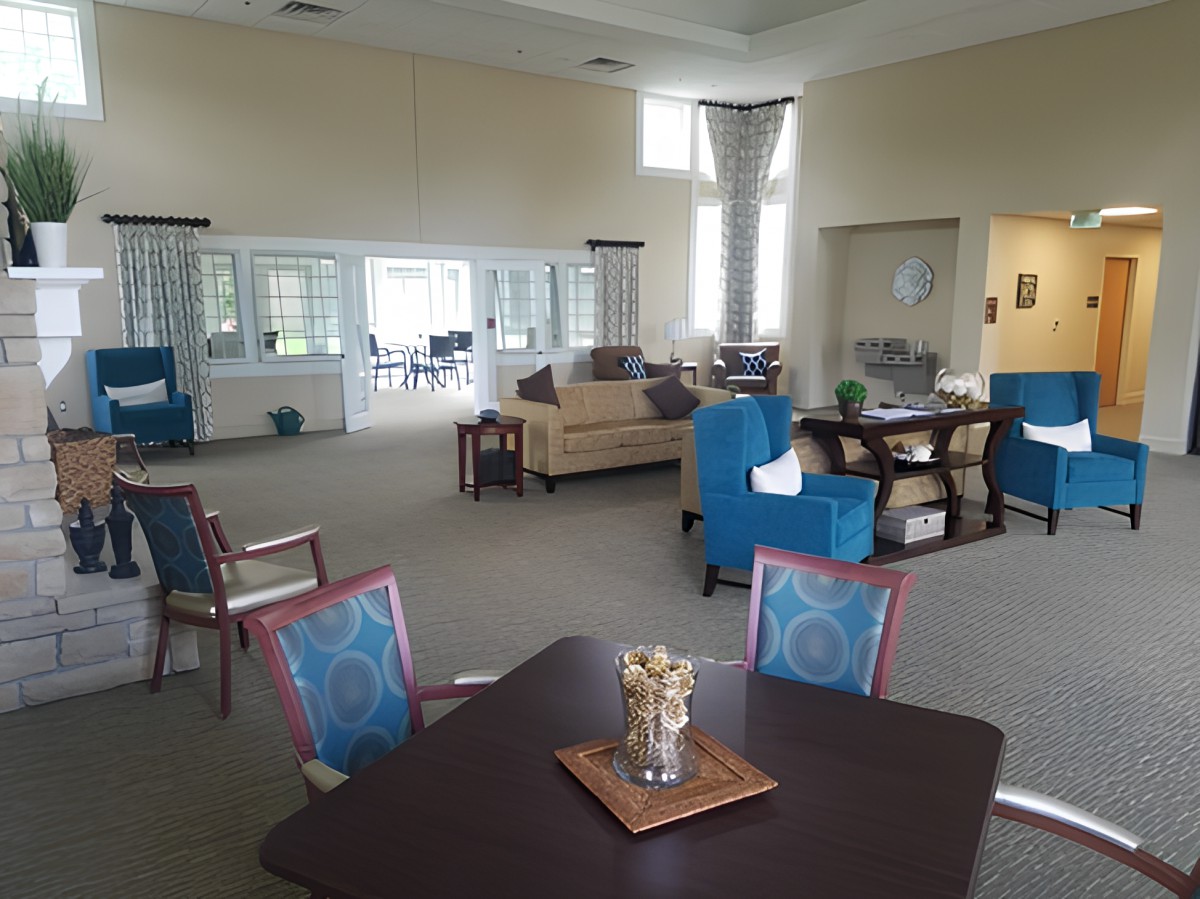 A spacious and modern living room with comfortable seating and abundant natural light.