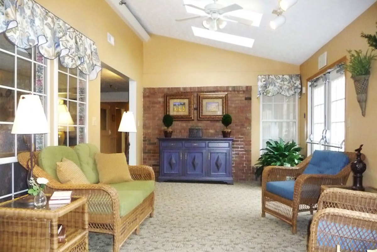 A cozy living room with comfortable seating, warm colors, and natural light.