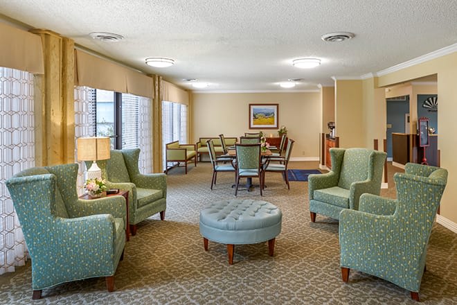 A cozy lounge area with comfortable seating and soft lighting.
