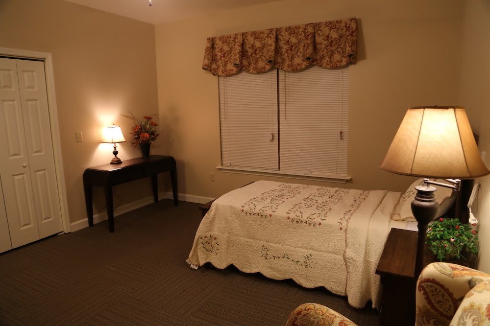 Cozy bedroom with warm lighting and elegant decor.