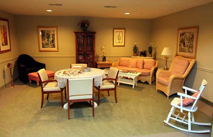 A cozy living room with a dining table and seating area.
