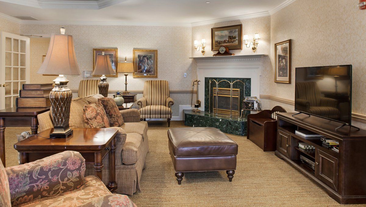 A cozy living room with elegant furniture and a fireplace.