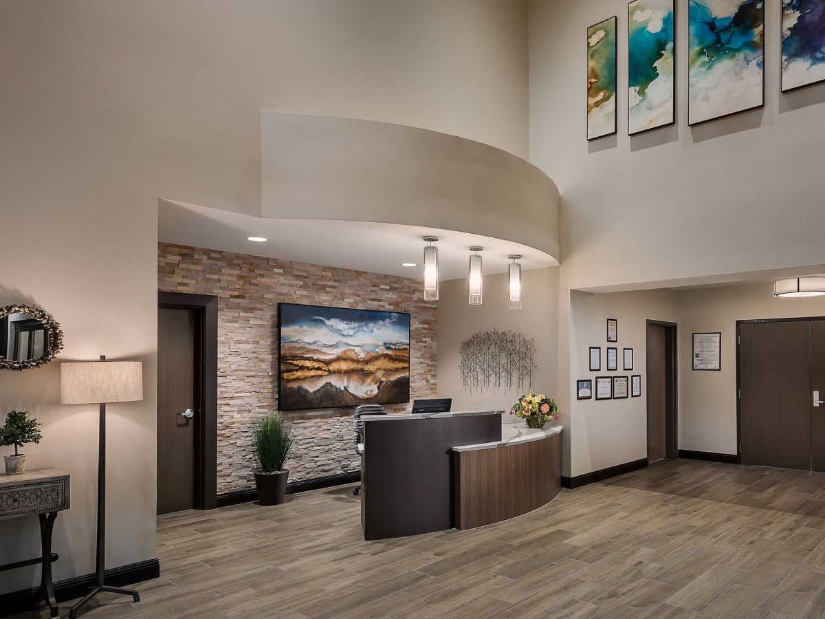 A modern office reception area with elegant interior design and artwork.
