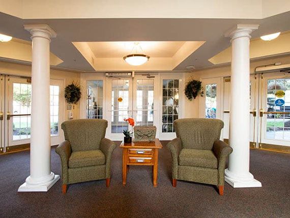 A cozy lobby with comfortable armchairs and elegant decor.