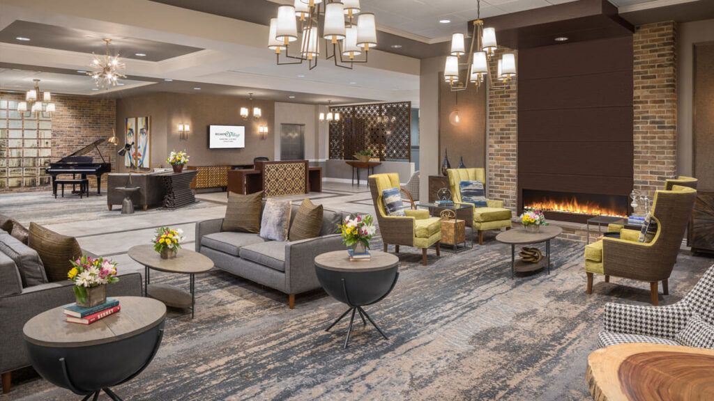 A modern hotel lobby with comfortable seating and elegant lighting.