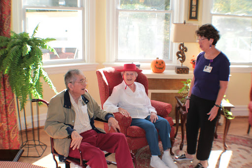 Seniors enjoying a moment together in a cozy indoor setting.