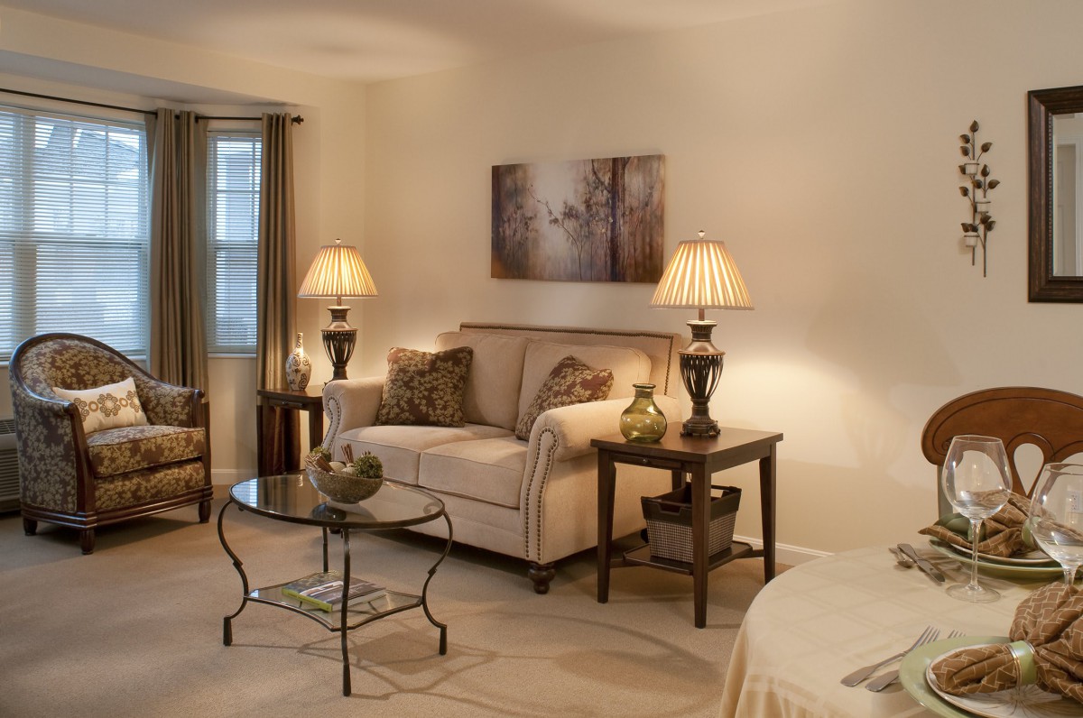 Cozy living room with elegant decor and warm lighting.