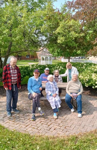 A sunny day at the park with friends enjoying each other's company.