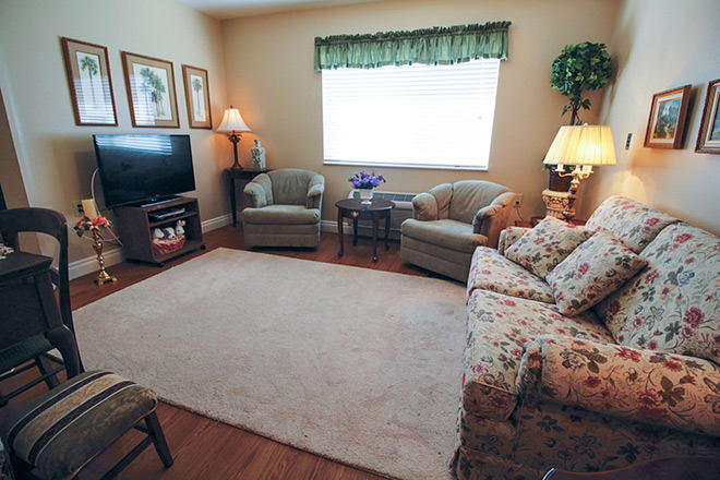 A cozy living room with comfortable seating and warm lighting.