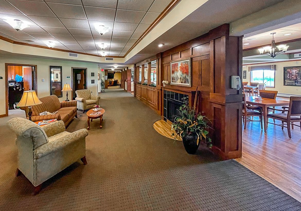 A cozy lobby with comfortable seating and warm lighting.