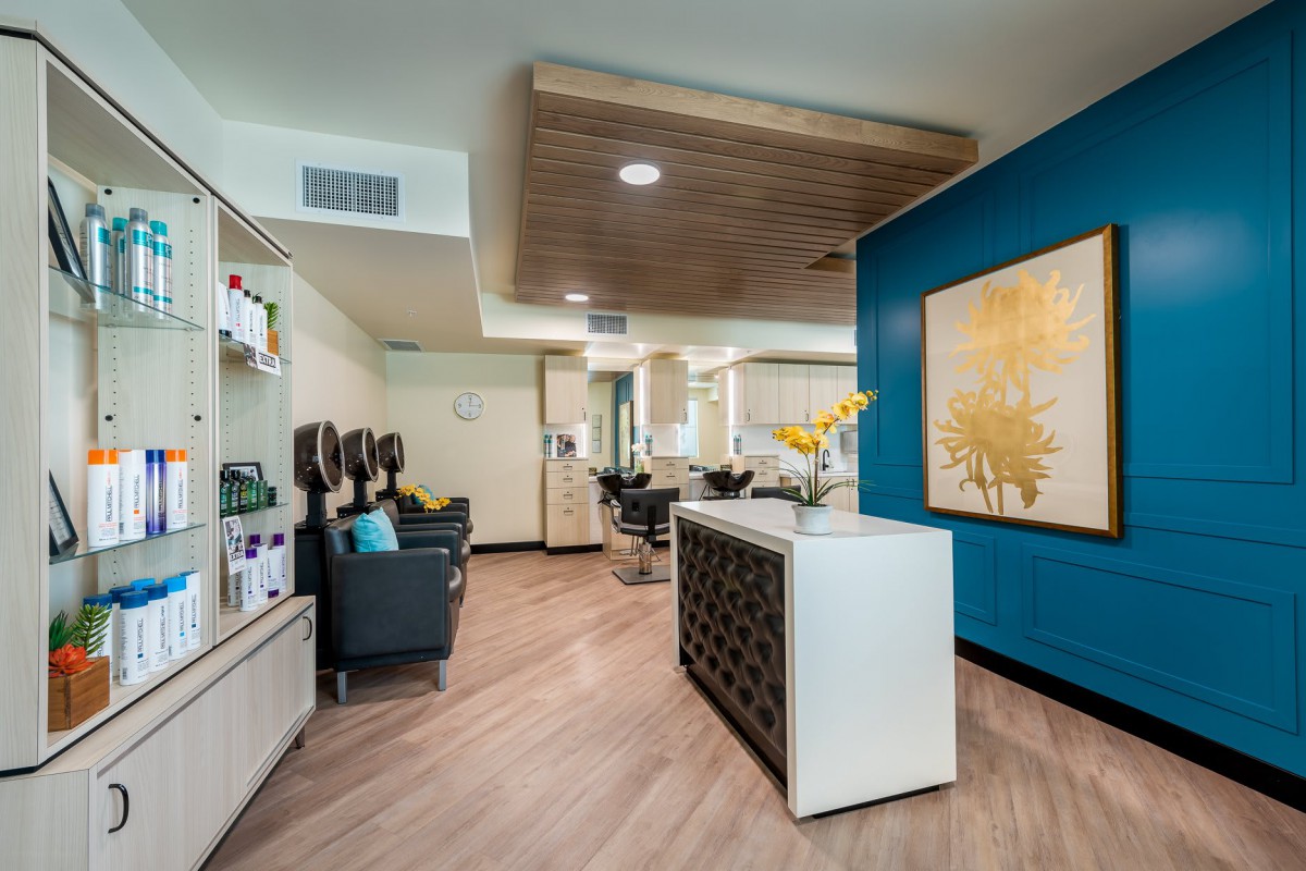 Modern salon interior with a cozy waiting area and stylish decor.