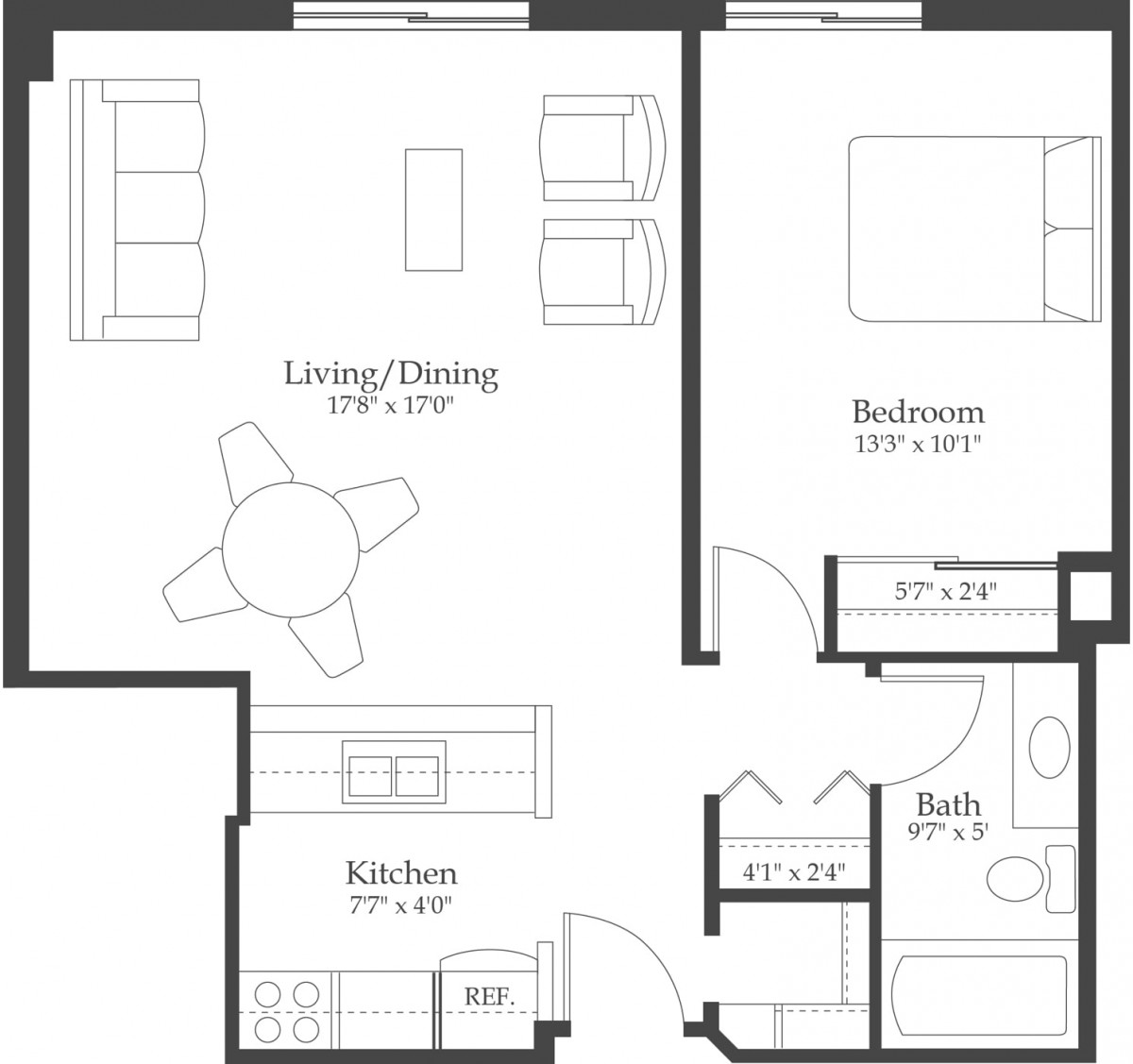 A floor plan of a one-bedroom apartment featuring a living/dining area, kitchen, bathroom, and bedroom.