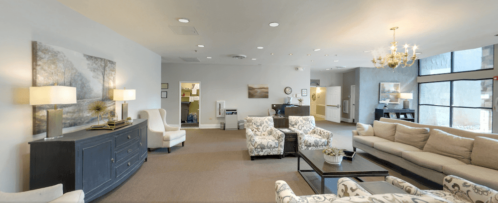A spacious and well-furnished lobby area with comfortable seating and a modern design.