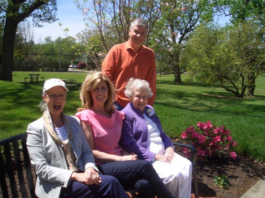 A group of people enjoying a sunny day in the garden.