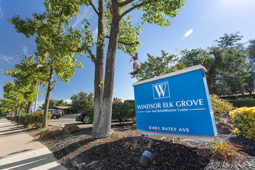 Entrance sign for Windsor Elk Grove, surrounded by greenery.