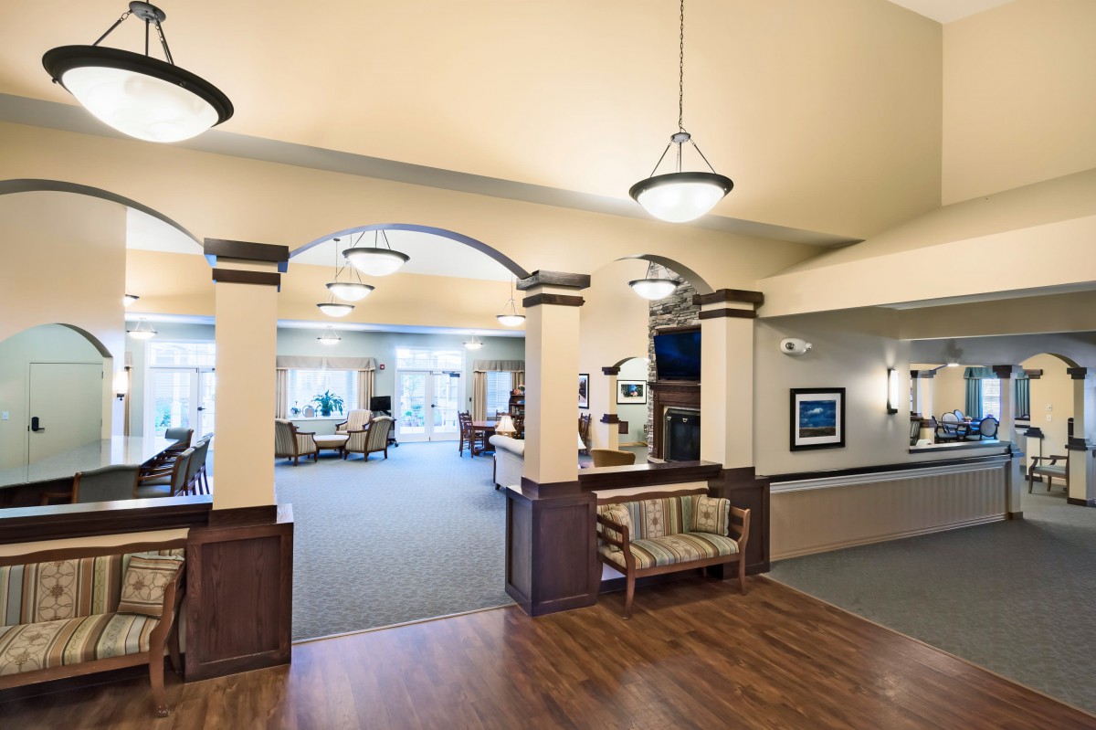 A spacious and well-lit lobby area with elegant furnishings and architectural details.