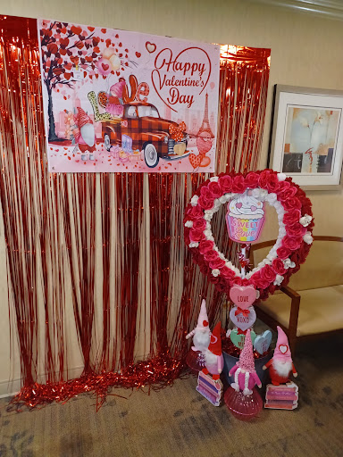 A festive display celebrating Valentine's Day with heart decorations and vibrant colors.