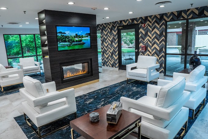 Modern living room with a sleek fireplace and stylish seating.