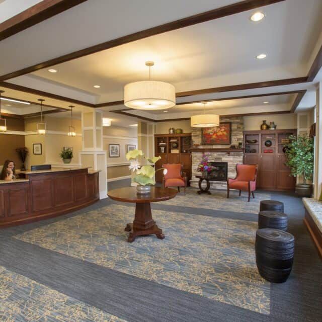 A modern and spacious lobby with elegant lighting and comfortable seating.