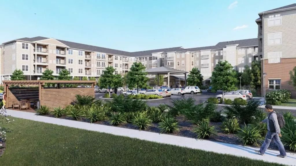 A modern residential apartment complex with landscaped surroundings.