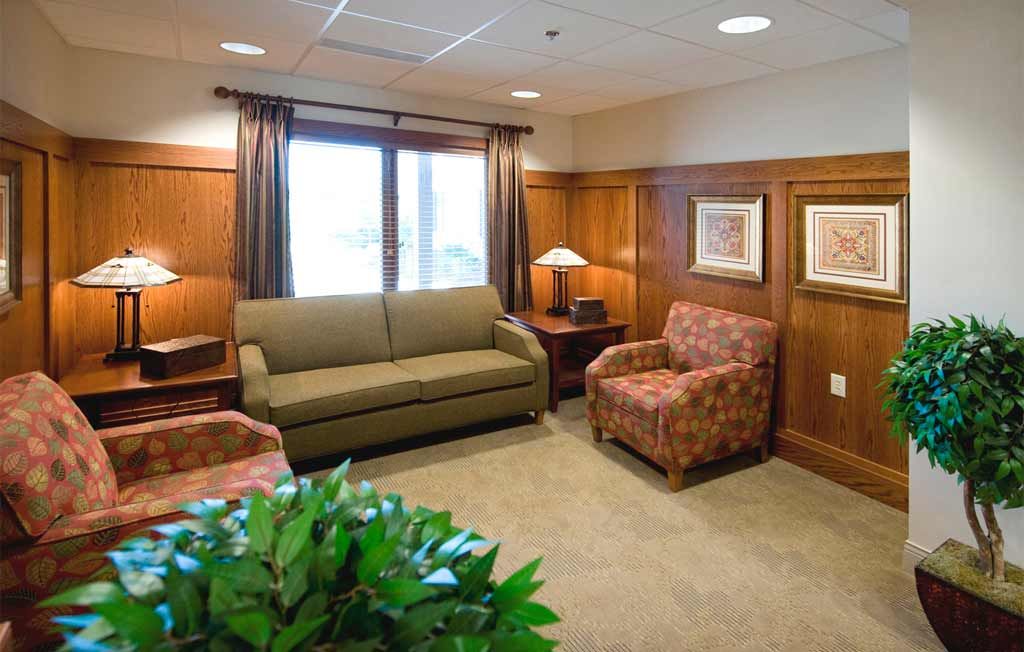 A cozy living room with comfortable seating and elegant decor.