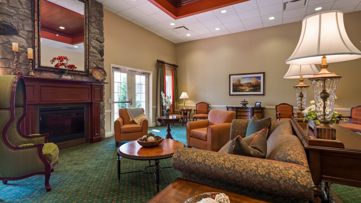 A cozy living room with comfortable seating and a fireplace.