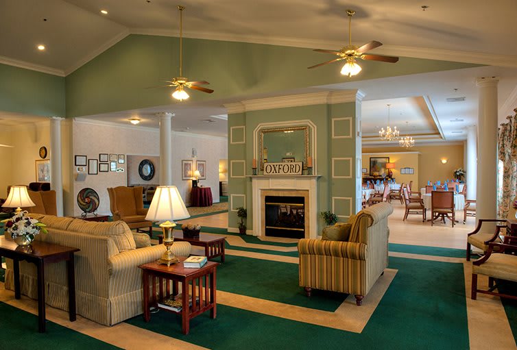 A cozy living room with a fireplace and comfortable seating arrangements.