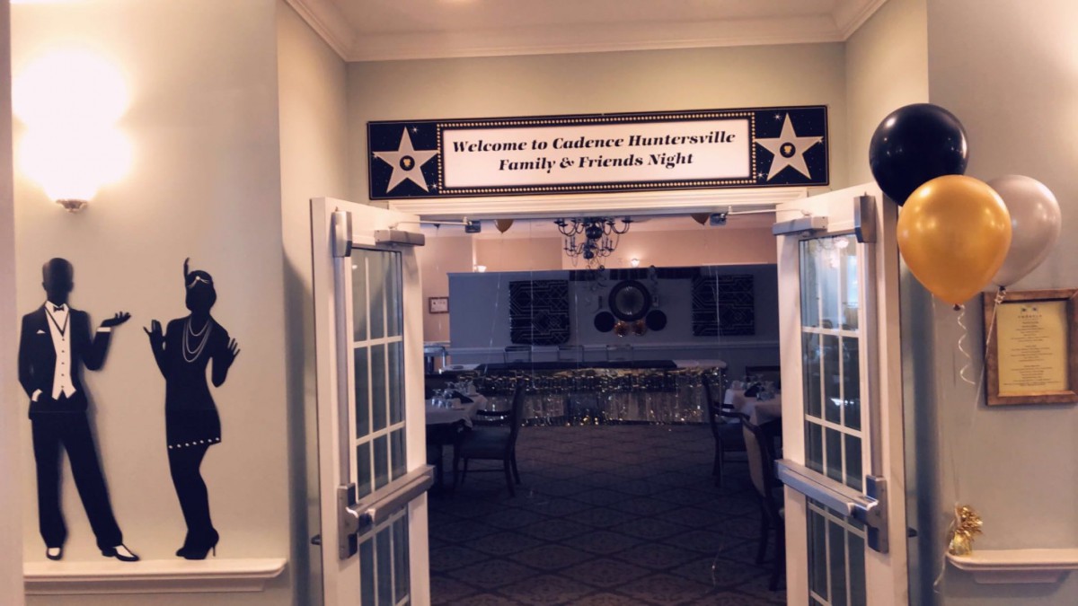 Entrance to a Family & Friends Night event with welcoming signage.