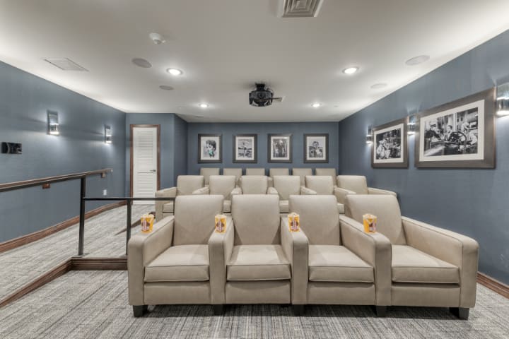 A modern home theater with comfortable seating and stylish decor.