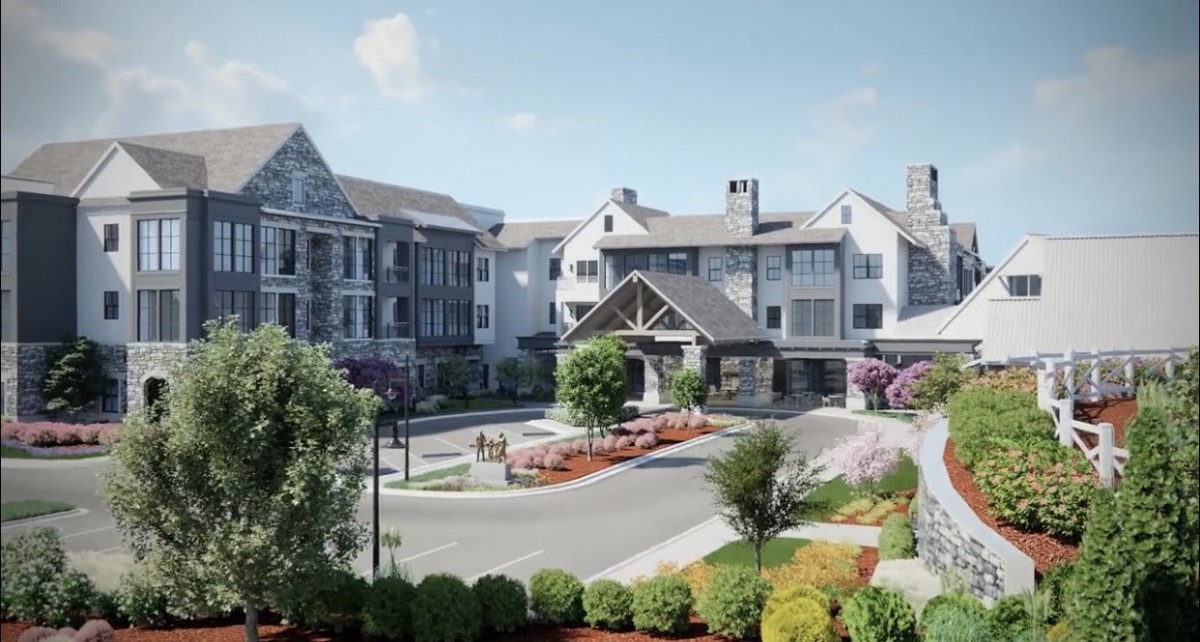 A scenic view of a residential building with landscaped surroundings and a welcoming entrance.