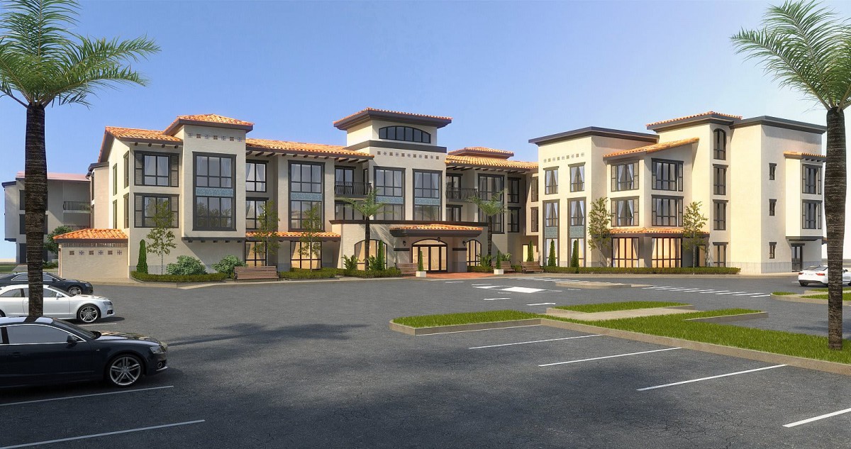 A modern commercial building with large windows and a spacious parking lot.