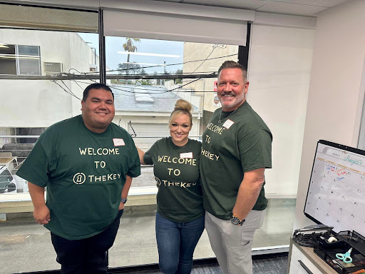 Team members welcoming new members at the office.