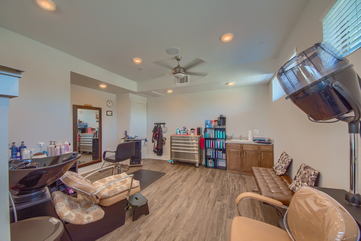 A modern pet grooming salon with organized stations and comfortable seating.