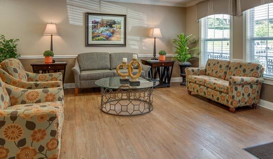A cozy living room with elegant furniture and warm lighting.